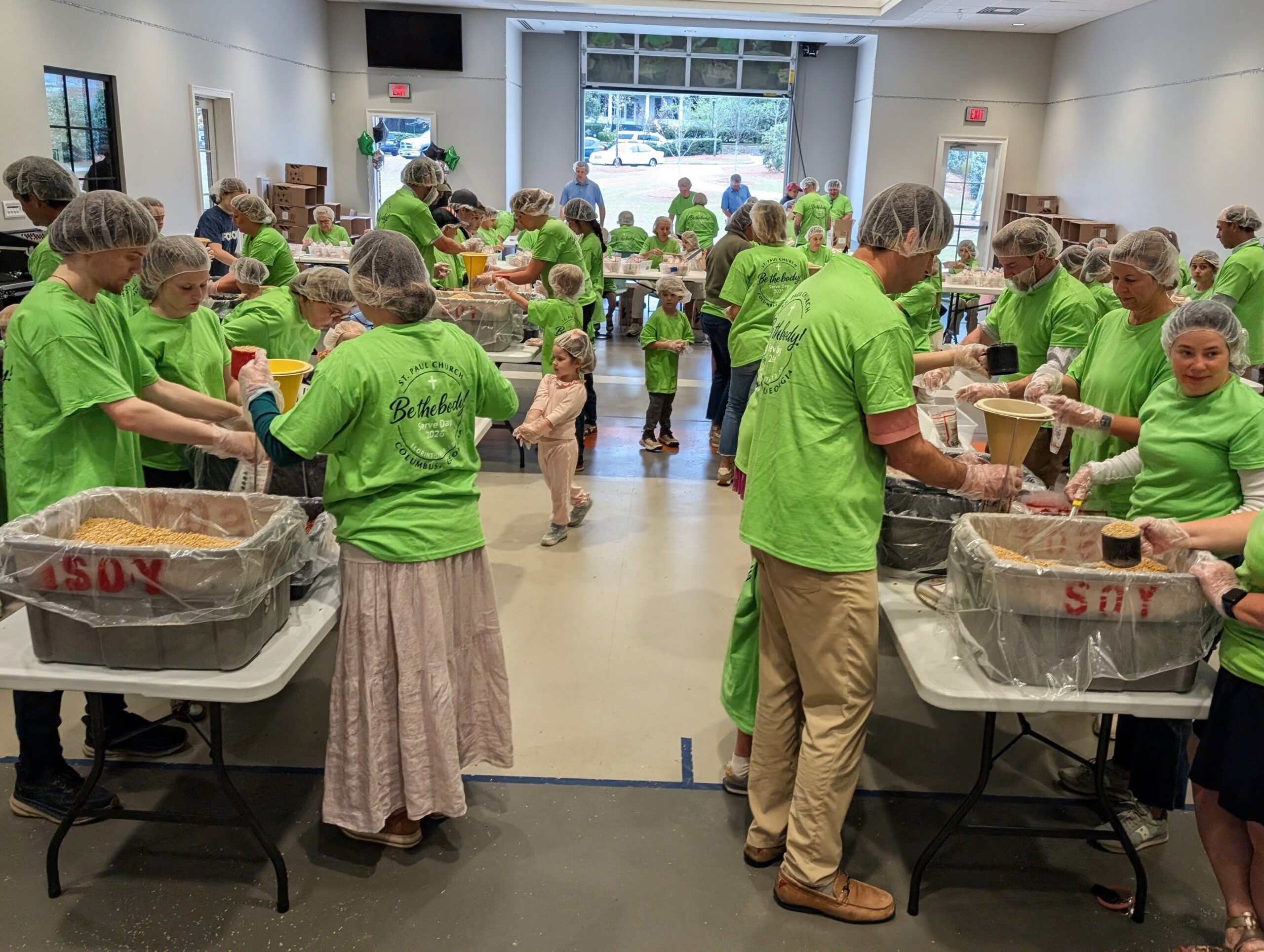 St Paul volunteers packing meals during Serve Day