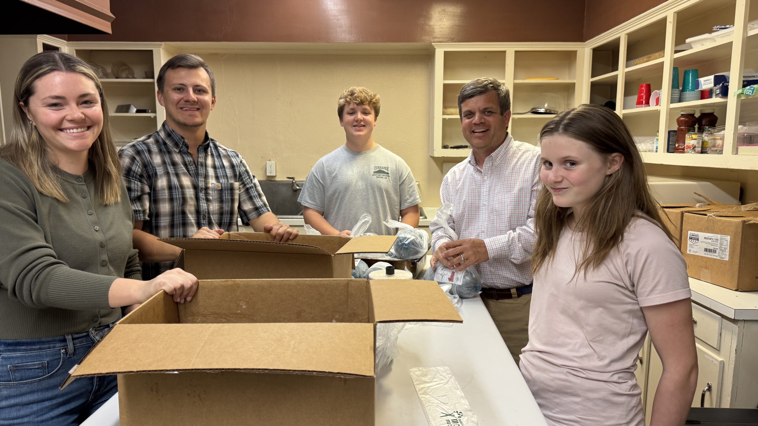 St Paul volunteers preparing community food boxes